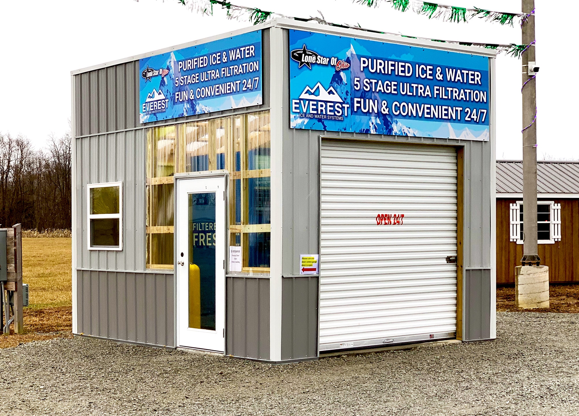 A portable building for an Everest Ice and Water Vending Machine with a closed door